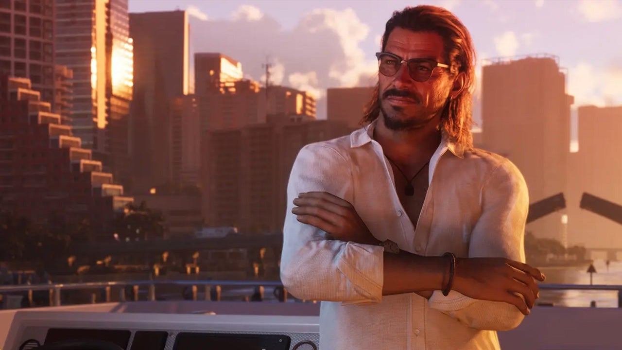 Man with Long Hair and Sunglasses Stands on a Yacht at Sunset Arms Crossed City Skyscrapers in the Background